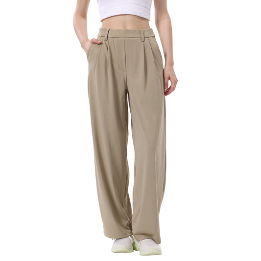 Beige wide-leg pants worn by a person on a white background