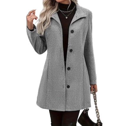 Person wearing a gray coat standing on snow-covered steps.